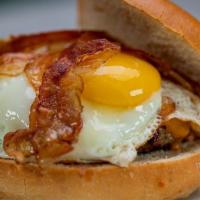 Breakfast Burger · 8 oz signature blend, Cheddar cheese and applewood bacon, single fried egg sunny side up.