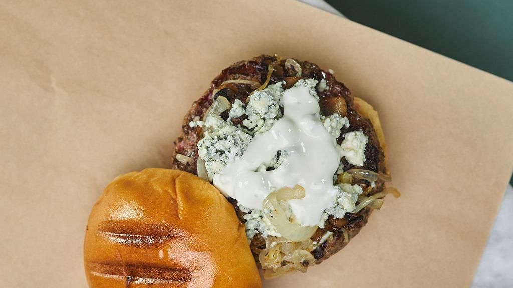 Black & Blue Burger · Our signature 8 oz blend topped with caramelized onions, mushrooms and chunky blue cheese.