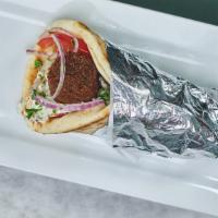 Falafel Souvlaki · Three perfectly cooked falafel balls in a pita, tzatziki, tomatoes, red onions, sprinkled pa...