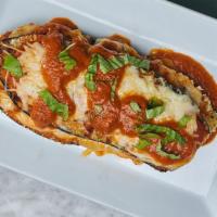 Eggplant Parmesan · Chef's signature recipe of a traditional dish.