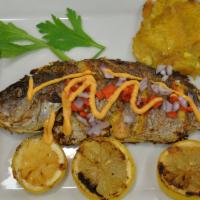 Poisson Griey - Grilled Snapper · Server with 12 oz Snapper, 2 Plantain ,Red Bean & Rice or White Rice & Black beans, Salad wi...