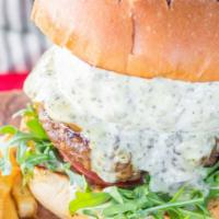 Italian Burger · 6 ounces of Meat Stuffed with provolone cheese and pesto. Along with baby arugula, tomatoes,...
