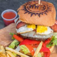 Argentine Burger · 6 oz of meat along with egg, provolone cheese, roasted peppers, Argentine sausage, chimichur...