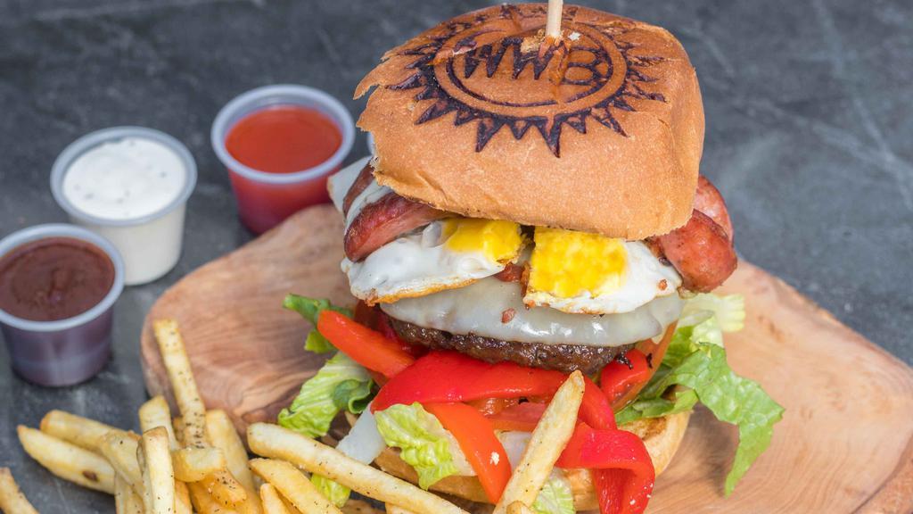 Argentine Burger · 6 oz of meat along with egg, provolone cheese, roasted peppers, Argentine sausage, chimichurri, tomatoes, onions, lettuce, and pickles. THE BURGER COMES WITH A SIDE OF FRIES