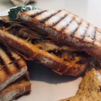 Chicken Club Panini · Organic chicken breast, turkey bacon, cheddar cheese, spinach, tomato, avocado and grilled o...