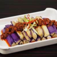 Zha Cai Eggplant · Fried Eggplant, house-made zha cai (pickled mustard) paste. (Vegetarian)
