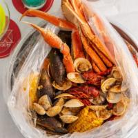 Small Platter · Snow Crab, Whole Shrimp, Crawfish, Mussels, Clams, Corn, and Potatoes.