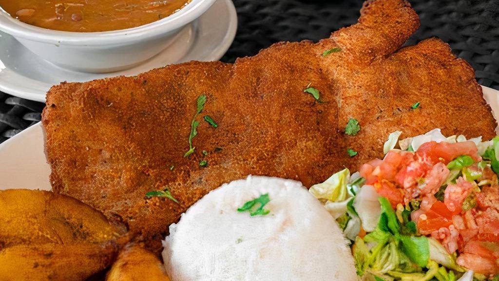 Chuleta CaleñA · Thinley pounded pork tenderloin lightly breaded and fried. Served with white rice, red beans, sweet plantains, and salad.