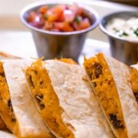 Quesadilla De Carne Y Champinones · Steak and mushroom quesadilla. Grilled steak, sauteed with mushrooms, onions, peppers and mi...