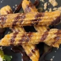 Churros · Tossed in Cinnamon and Sugar