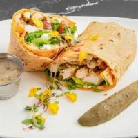 Mediterranean Grilled Chicken Wrap · Grilled chicken breast sliced romaine lettuce, tomato, kalamata olive, feta cheese, and humm...