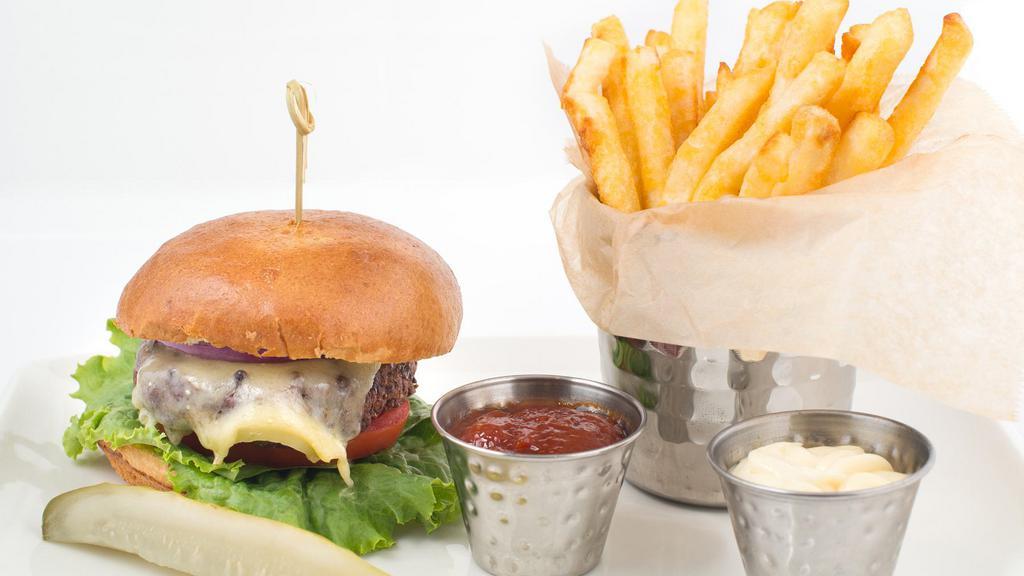 Turkey Cheeseburger · Gruyere cheese, lettuce, tomato and onion, brioche bun, served with French fries and pickle