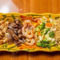 House · Served with medium steak, chicken, shrimp, broccoli, cabbage, carrots, onions & steamed rice...