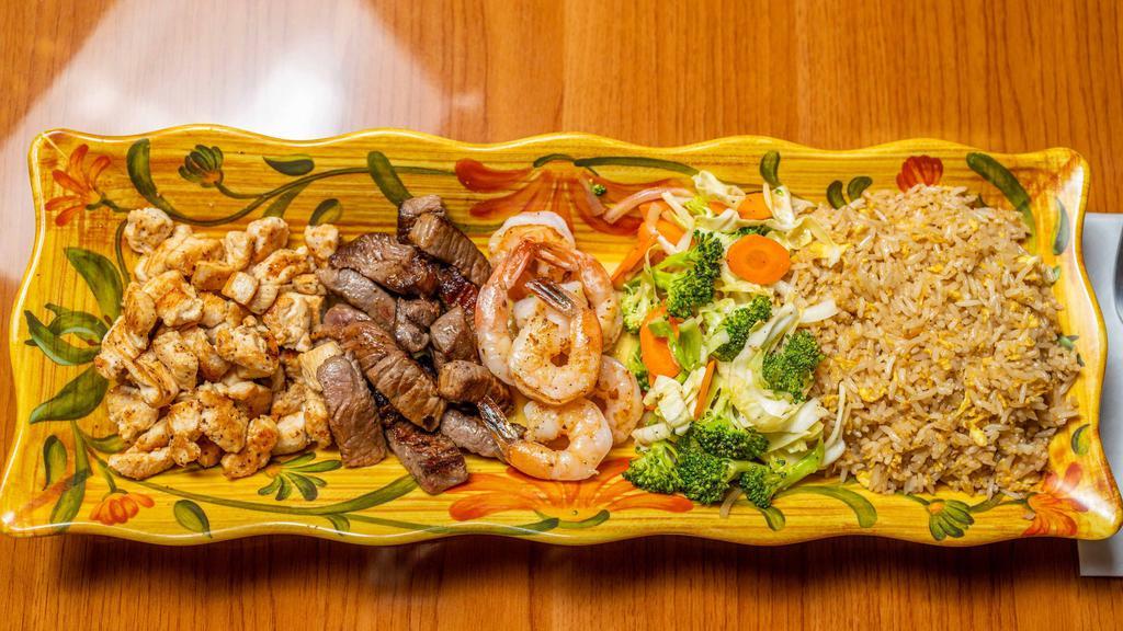 House · Served with medium steak, chicken, shrimp, broccoli, cabbage, carrots, onions & steamed rice or fried rice. Yum yum sauce on the side.