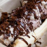 Banana Split  · One banana face open, with three scoops of Neapolitan ice cream, whipped cream, crushed cone...
