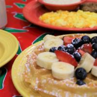 Fl Sunshine Waffle Breakfast · Two eggs, choice of breakfast meat, choice of side, a golden Belgian waffle topped with fres...