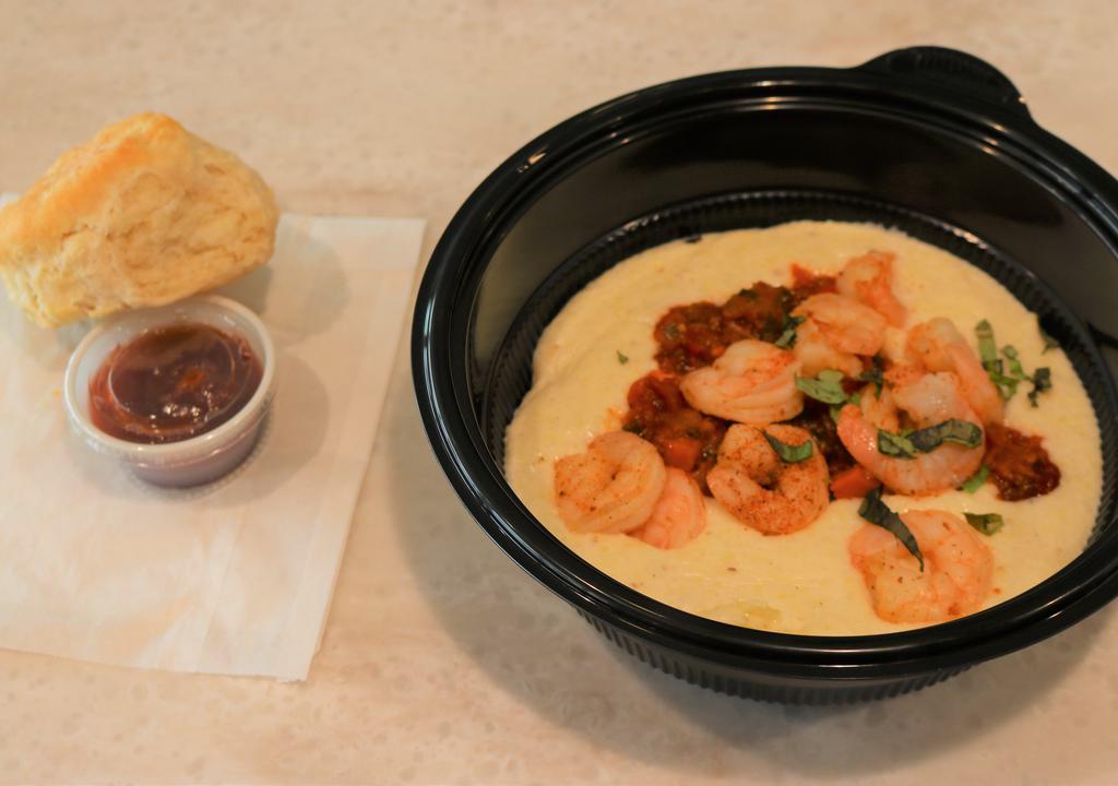 Shrimp And Grits Entree · Creamy dreamy white cheddar cheese grits topped with 10 blackened shrimp and a rustic roasted red pepper and tomato sauce, garnished with fresh basil and served with a fluffy flying biscuit.