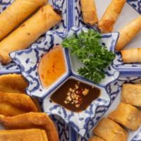 Thai Emerald Sampler · Four pieces of crab rangoon, two pieces of fried spring rolls, four pieces of fried tofu and...