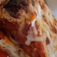 Lasagna Quattro Formaggi · House-made pasta layered with fresh ricotta, mozzarella, provolone and Parmesan with pomodoro.