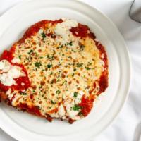 Veal Parmigiana · Pounded 16 Oz veal chop, bone-in. Glazed with tomato and mozzarella.