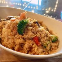 Ts11. Veggie Fried Rice · Broccolis, potatoes, mushrooms, carrots, tomatoes, and zucchinis stir-fried with rice in tom...