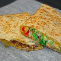 Shawerma Quesadilla · Chicken shawerma, along with garlic sauce, lettuce, tomatoes, pickles in a delicious cheese ...