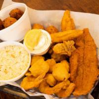Seafood Platter · Perfectly battered and fried gulf shrimp, oysters, scallops, grouper and catfish.