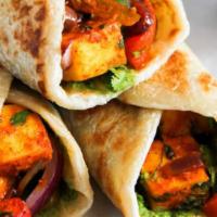Paneer Wrap · Vegetarian. Minced paneer tikka pieces in Indian special sauce wrapped with naan or chapati ...