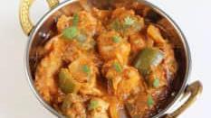 Kadai Paneer · Cubes of paneer cooked with ginger, garlics, onion, and tomatoes in a semi dry gravy.