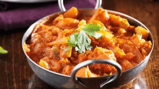 Lamb Tikka Masala · Tender boneless lamb pieces boiled in tandoori and cooked in a mild creamy tomato gravy with onions and bell pepper.