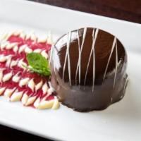 Flourless Chocolate Torte · Semi-sweet, glazed with dark chocolate, Bailey's creme anglaise & port wine reduction