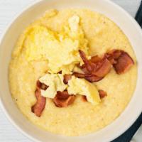 Breakfast Grits Bowl · Yellow stone ground grits cooked  with cream and vegetable broth, scrambled eggs; choice of ...