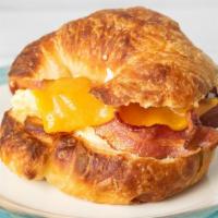 Breakfast Croissant · Freshly baked giant croissant, mayo,
 bacon or  breakfast sausage, scrambled eggs, American ...