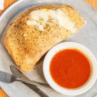 Calzone · Pocket of dough, stuffed with mozzarella, ricotta, and Romano cheeses. ( No More then 4 topp...