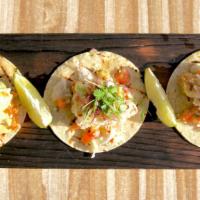 Grilled Shrimp Tacos · Gulf shrimp, aji Amarillo aioli, coleslaw, pico de gallo, queso fresco.