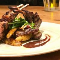 Grilled Lamb Chops · Bone-in 8 oz lamb chops, roasted fingerling potatoes, blueberry demi sauce.