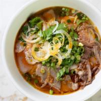 Spicy Vermicelli Noodle Soup · Served with vegetables, rare eyeround steak, brisket and pork. Add chicken, tofu, shrimp for...