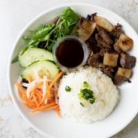 Steak Com · Favorite. Pan seared steak cubes and a side of soy sauce. Steamed rice served with salad wit...