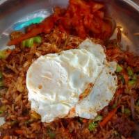 Bibimbap* · Chicken or steak, stir fried rice and vegetables in  gochujang topped with a fried egg.