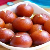 Gulab Jamun (3Pcs) · Gulab jamun is an Indian dessert of fried dough balls that are soaked in a sweet, sticky sug...