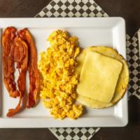 #2 Eggs Of Choice · Eggs any way you like. Arepa with cheese, ham or bacon, and drink of choice coffee or soda. ...