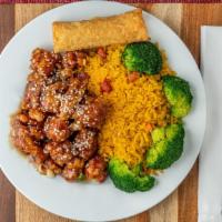 Sesame Chicken · Served with an egg roll and a choice of staple.