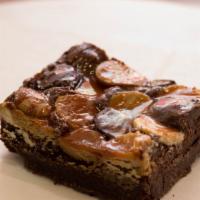 Sweet Indulgence Brownie · Milk chocolate, Dark Chocolate and White Chocolate on a fudge brownie