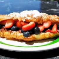 Nutella And Seasonal Fruit Sandwich · Nutella, blueberries and strawberries croissant sandwich.