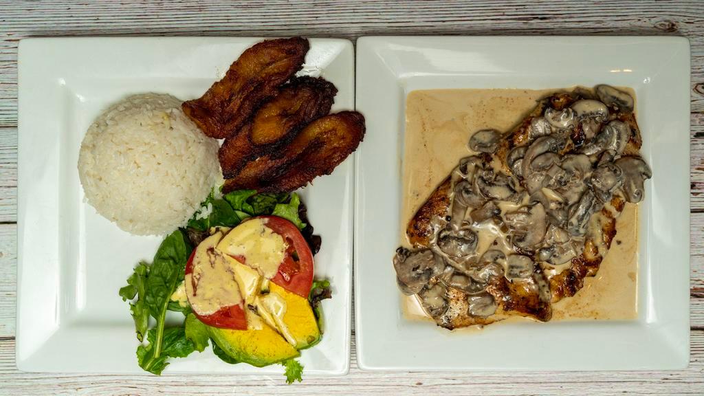 Carne Con Champiñones · Beef stek with mushrooms sauce. With Rice, salad and sweet plantains.