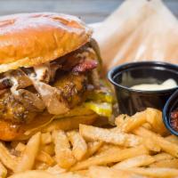 Diner Burger · Double beef patty, tillamook cheddar, dill pickles, grilled onions, slab bacon, aioli, brioc...