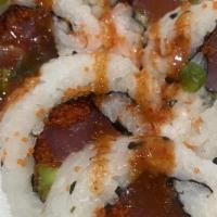 Spicy Tuna Roll · Spicy. Tuna, cucumber, masago, sesame seed served with kimchee sauce. 10 pieces, rice outside.