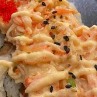 Volcano Mix Roll · Salmon, krab, cream cheese, topped with baked seafood dynamite scallion and masago served wi...