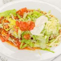 Nachos Supremos · Chicken or beef nachos topped with beans, lettuce, tomato, cheese, sour cream and jalapeños.