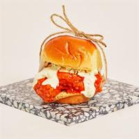 Buffalo Chicken Slider · Crispy fried chicken with buffalo sauce, ranch, and blue cheese crumbles on a toasted bun.